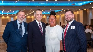 Robert Merkley (Merkley Building Supply Ltd.), Mayor Mark Sutcliffe, Soula Burrell (GOHBA) and Jason Burggraaf (GOHBA) at GOHBA Breakfast with the Mayor, Saint Elias Banquet Centre, Jan 8, 2026.