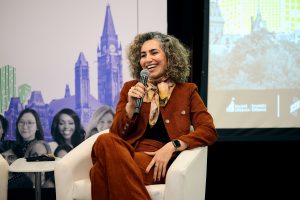 Keynote speaker Tara Akhavan, a global tech leader and founder, takes the stage to share insights on scaling innovation and building impact.