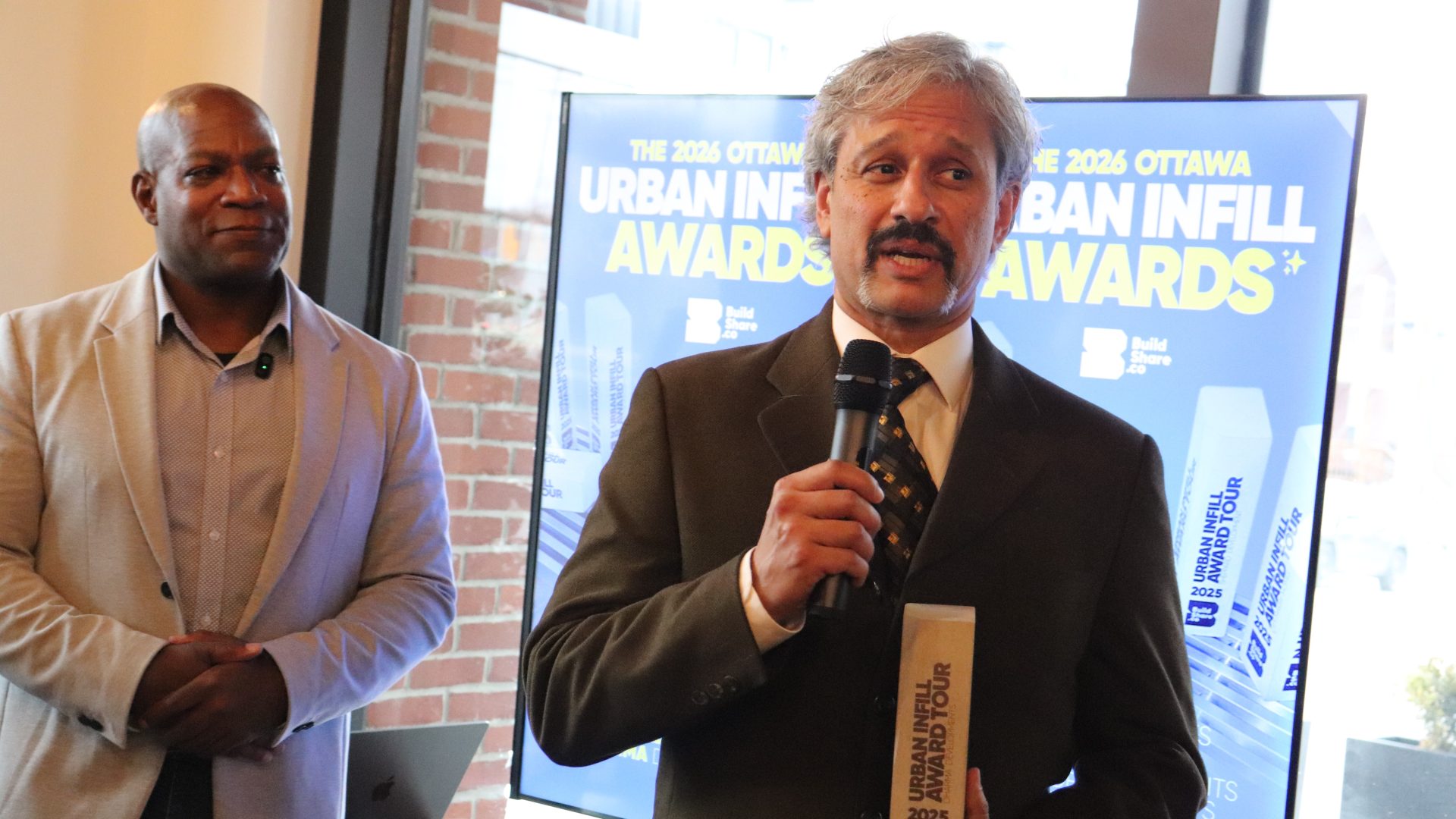 Russell Coltess (left), founder of Buildshare and Akash Sinha, president of Dharma Developments at the 2026 Ottawa Urban Infill Awards on Wednesday. Photo by Mia Jensen