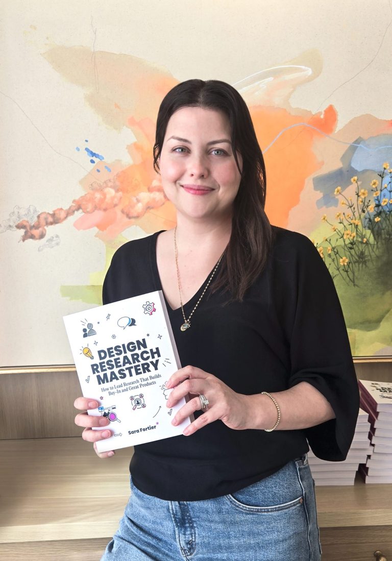 Outwitly founder Sara Fortier with her debut book, Design Research Mastery. Photo supplied.