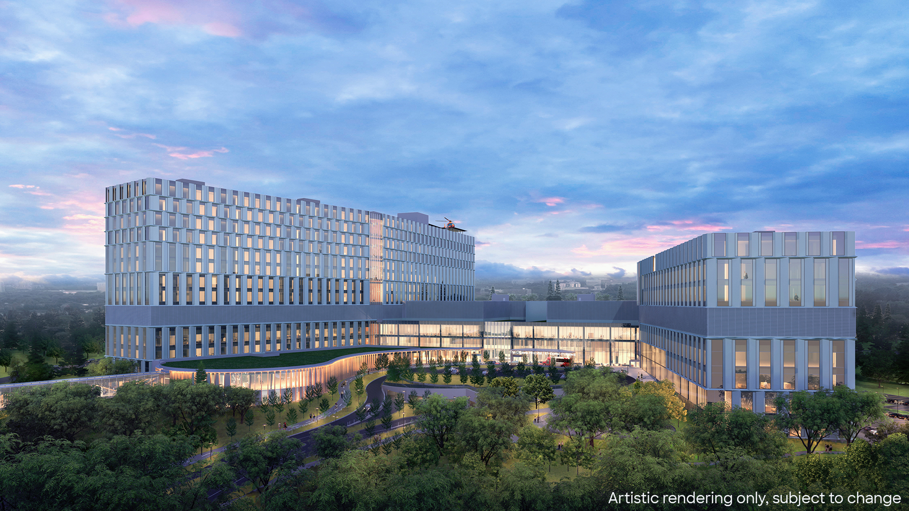 Exterior view of the new hospital at dusk.