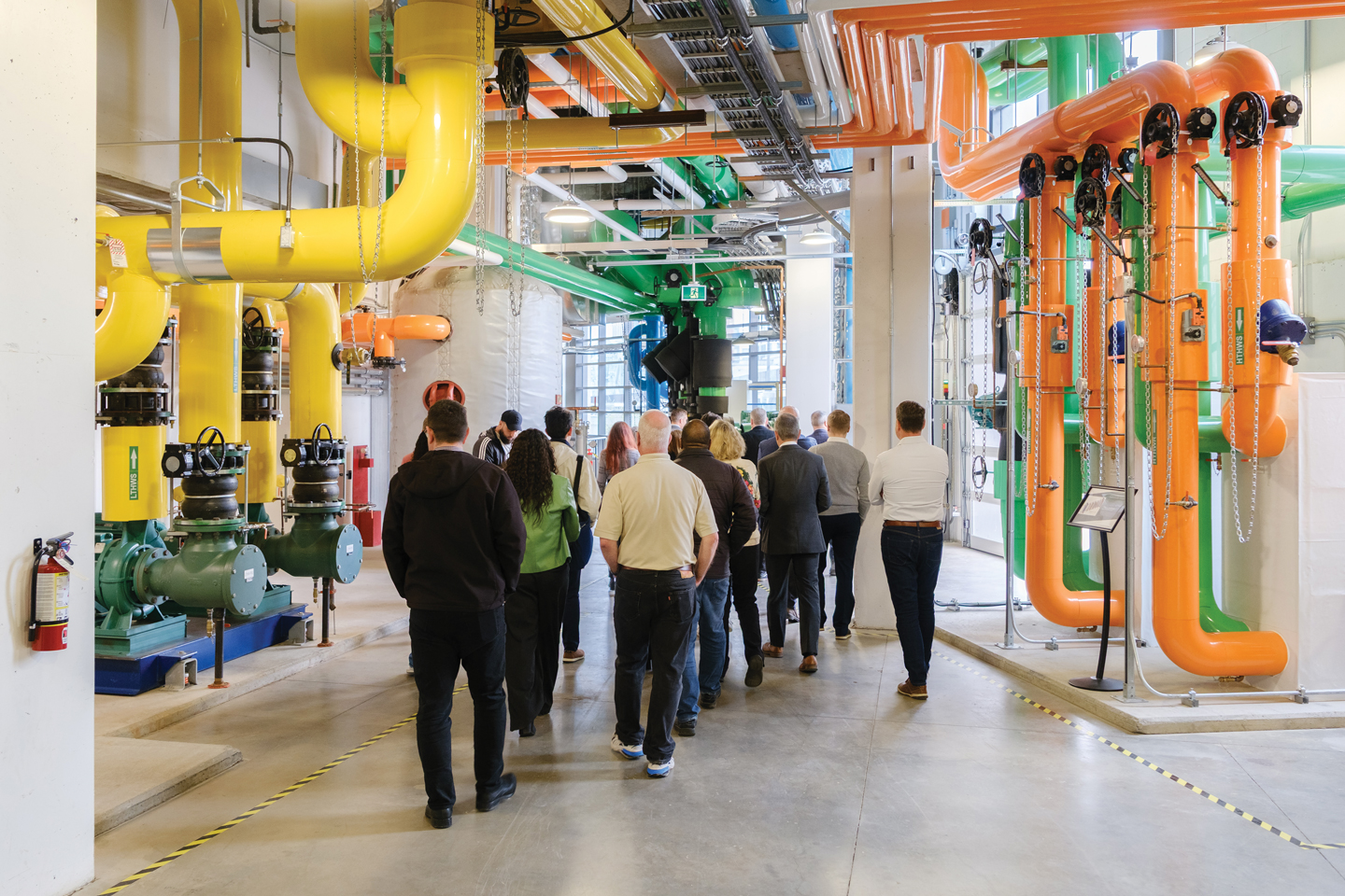 A group tours the central utility plant at the Zibi Community Utility - another district energy partnership between Hydro Ottawa and the Zibi project. Image courtesy of Hydro Ottawa.
