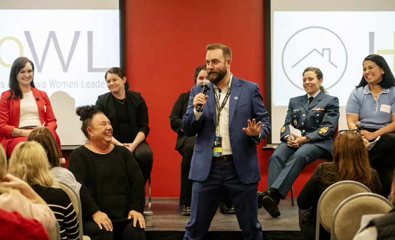 Thomas Gilbert (CEO of Ottawa Rapid FC) saying a few words before the panel discussion at GOHBA's HOWL – Women Breaking Ground, TD Place, May 13th, 2026. Photo by Tia MacPherson-Abdulla for OBJ. (From L-R) Co-moderator Siobhan LeCours (Mr. Foundation Inc.), Soula Burrell (GOHBA), Panelist Diana Matheson (Founder Northern Super League), Panelist Alyssa Stack (Cardel Homes), Panelist Chief Warrant Officer Bouchard (Chief Professional Conduct and Culture Command Chief Warrant Officer (CPCC CCWO), Co-moderator Jenniffer Alvarenga (Good Story - RE/MAX Hallmark Realty Group)