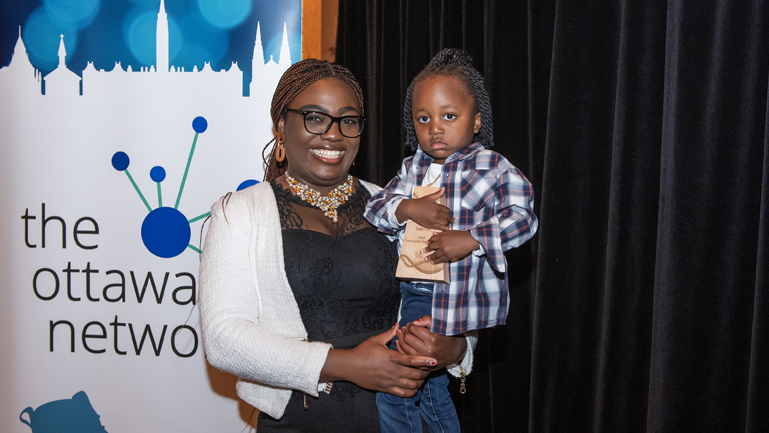 El Gibbor Djiki of Twish Cart and her son after being awarded the Community Impact Award at the Bootstrap Awards, The Marshes Golf Club, May 5, 2026. Photo by Tia MacPherson for OBJ.