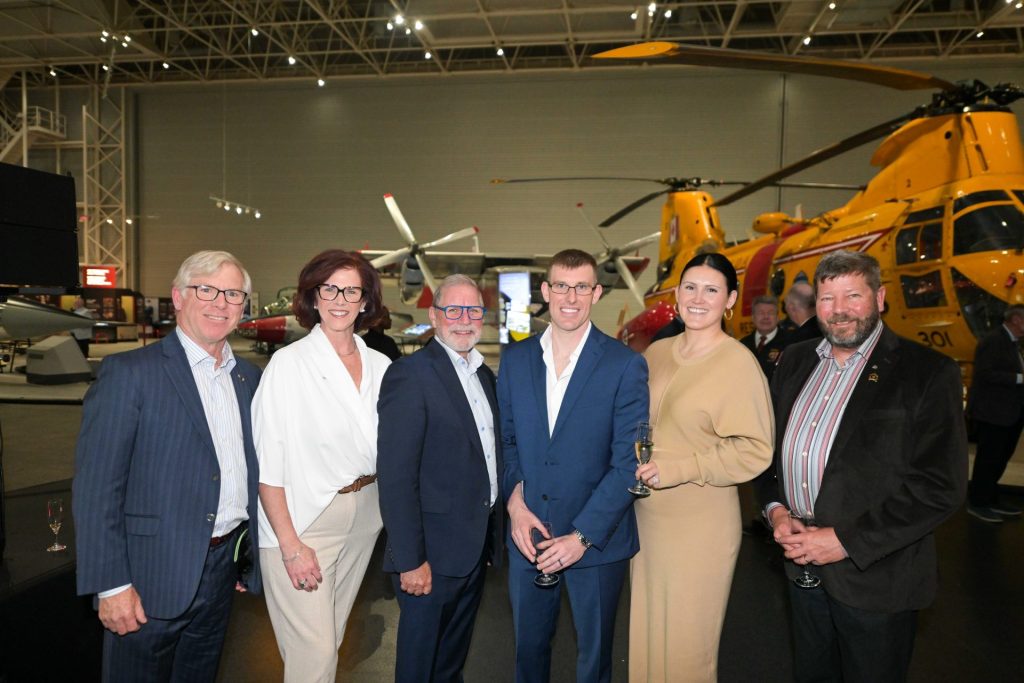 Left to right: LGen (Re’d) Stu Beare (Soldiers Helping Soldiers), J’Lyn Nye (member of VHC Board of Directors), Michel Charron (CEO, Commissionaires Ottawa), Major Colin Carswell, Marie-Pier Nault (spouse of Major Colin Carswell), and BGen (Ret’d) Alan Mulawyshyn (Executive Director, VHC) gather during Veterans’ House Canada’s Andy Carswell Building 5th Anniversary celebration at the Canadian Aviation and Space Museum. Photo by James Park.