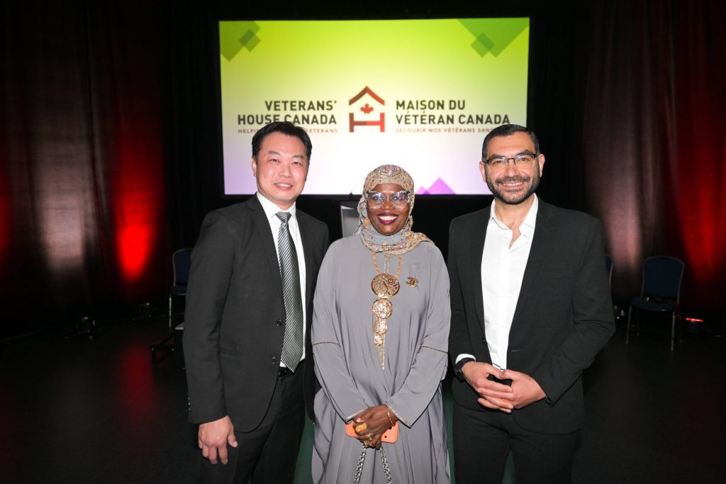  Left to right: Sheldon Leong (Director of Fund Development, Multifaith Housing Initiative), Sahada Alolo (Director of Community Engagement, Multifaith Housing Initiative), and Ala’a Shadid (Executive Director, Multifaith Housing Initiative) pose for a photo after the formal program at Veterans’ House Canada’s Andy Carswell Building 5th Anniversary celebration at the Canadian Aviation and Space Museum. Photo by James Park.