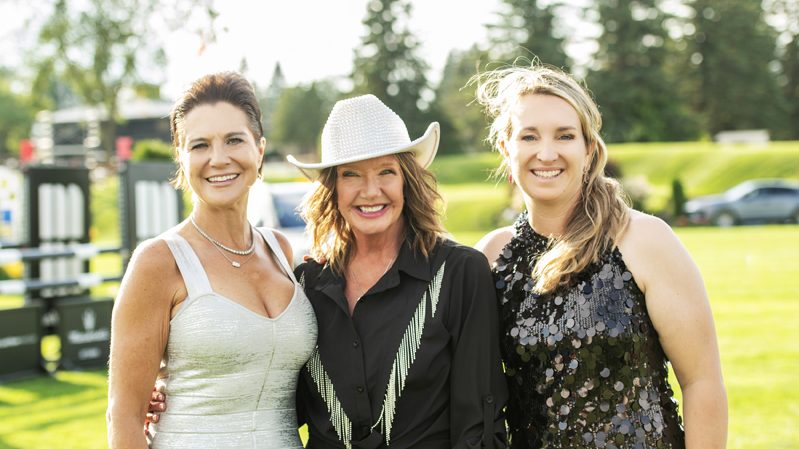 Event co-hair Catherine McLaughlin, Queensway Carleton Hospital Foundation's Shannon Gorman and event co-chair Karen Sparks at Spurs and Sparkles in support of Queensway Carleton Hospital at Wesley Clover Parks on Aug. 12, 2026. Photo by Tia MacPherson-Abdulla/OBJ.