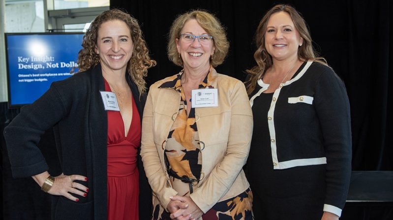 From left: Melissa Gardner (Relax Massage Group), Karen Craft (CraftXecsa) and Deidre Desrochers (Relax Massage Group) at OBJ Best Place To Work and DisruptHR Ottawa 2026 at the Algonquin Commons Theatre, Oct. 6, 2026. Photos by Tia MacPherson-Abdulla/OBJ.